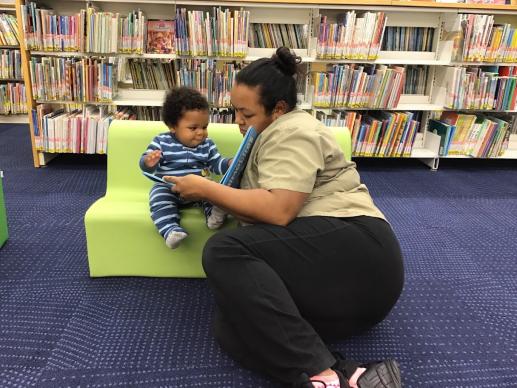 Parent and child sharing a book