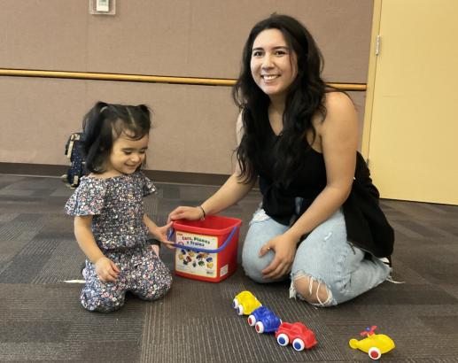 A family playing at the library's Parent-Child Workshop.