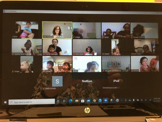 A computer screen with tiles of people participating in a Zoom meeting