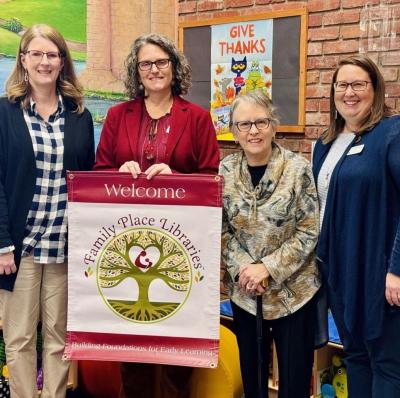 Photo of Canton Library Staff and Foundation Members holding Family Place Banner