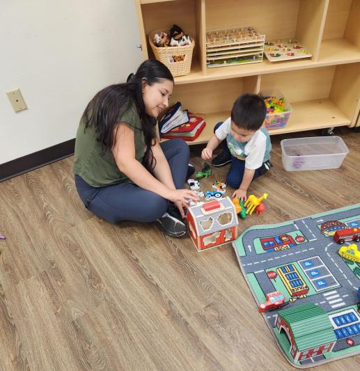 A mother and child playing together at Our Family Place Workshop
