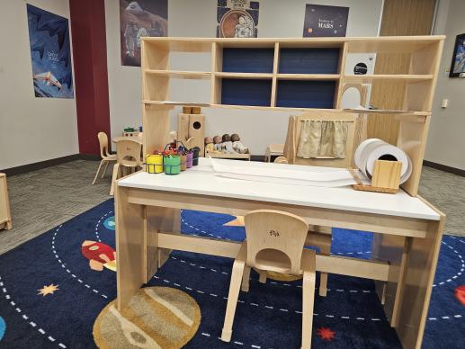 A picture of the play area that includes a coloring table