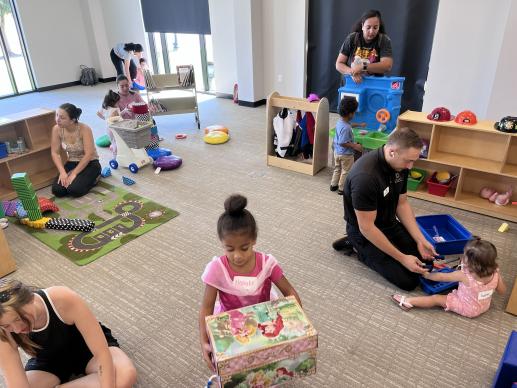 Children playing at stations.  We had a few dads join us