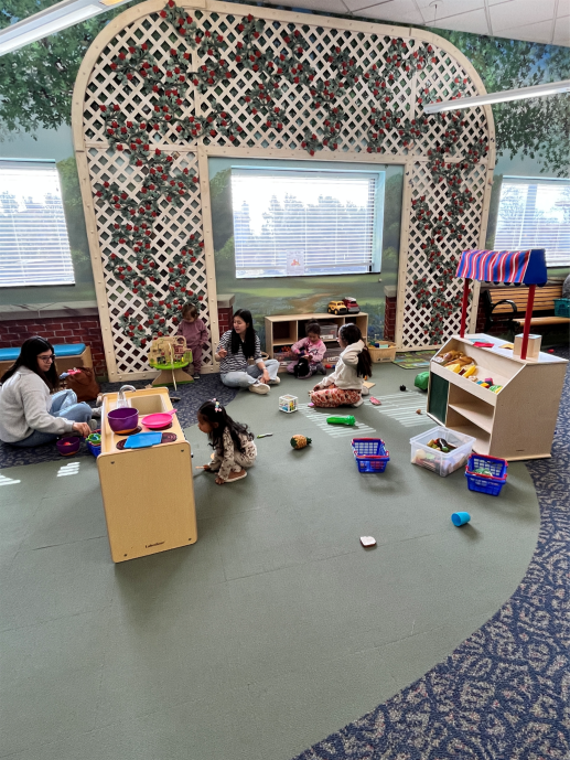 Families playing in refreshed early learning play area.