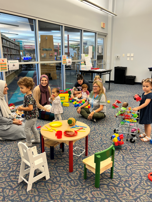 Families playing and talking to profession at Fall 2025 workshop.