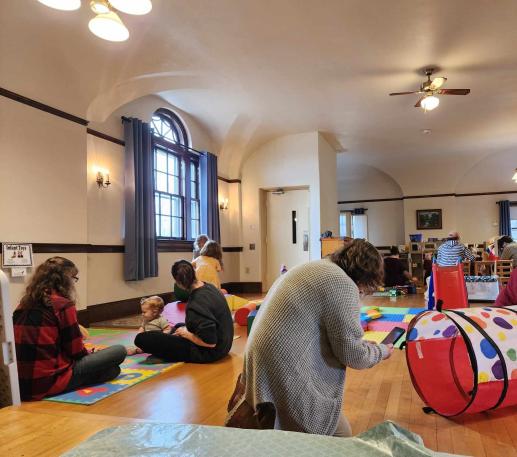 families play in parent child workshop space