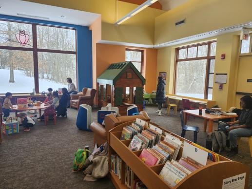 Brecksville Branch children's play area has a cabin and boat for imaginary play along with many toys.