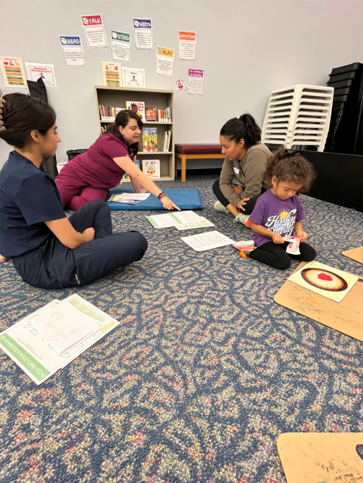 Two CRP talking to mom at workshop