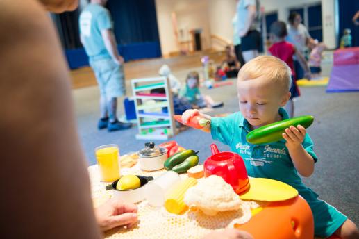 Child playing with kitchen during Family Place