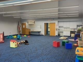 Parent-Child Workshop space with kitchen, art area, blocks, workbench, manipulatives, and gross motor activities