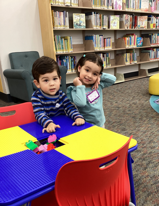 children playing with lego table