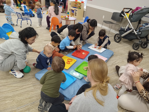 Caregivers and children playing with homemade playdough