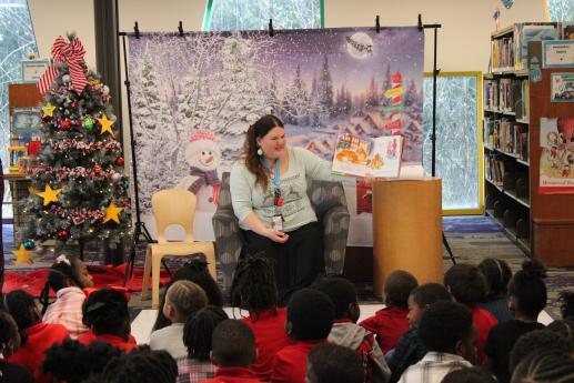 Kindergarteners gathered to listen to a holiday story time.