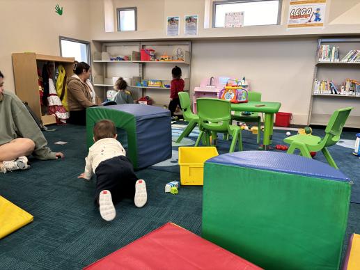 Young children play with soft climbing toys in the South Oxnard Branch Library's Family Place