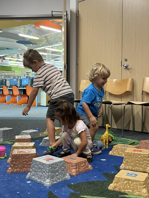 Children climbing on fake rocks.