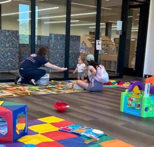Family Place Playgroup Resource Professional interacting with Parent and Child in October 2024 Traphene Hickman Library