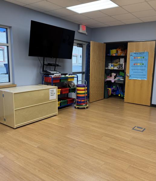 Stay and Play group area includes a locking toy cabinet, books, story time cushions and play group toys in the closet. 