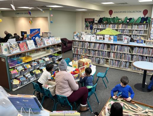 Families playing in the library. 