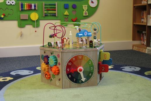 The Baby Zone features board books, toys, and sensory centers for infants and toddlers.