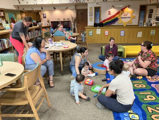 Parents getting to know each other and their children. Discussing future playdates.