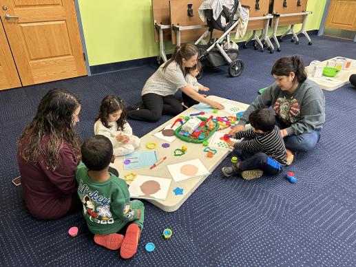 Toddlers & caregivers playing together