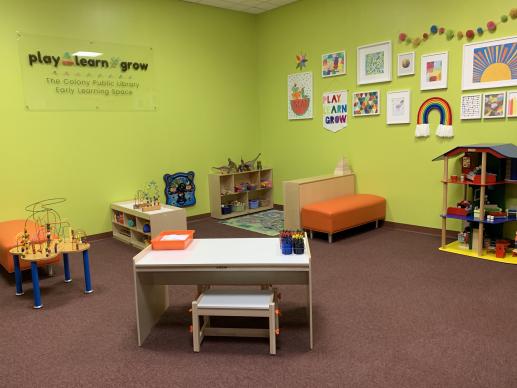 Play space with tables, benches, and toys