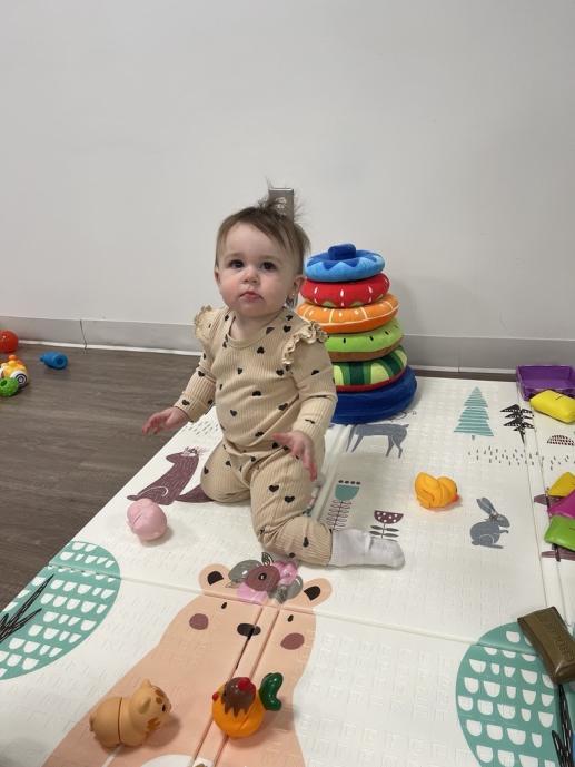 waddler playing with stackable toys