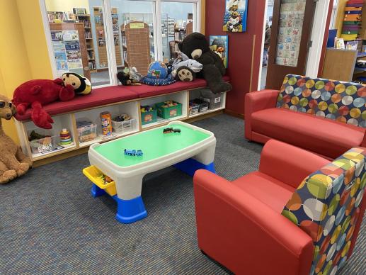 Baby and toddler play area with wipeable furniture and plenty of toys easily accessible.
