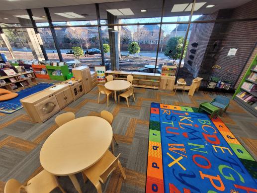 Lafayette Branch Library Norfolk Public Library Family Place KidZone set up with colorful carpets and toys to invite children to play.