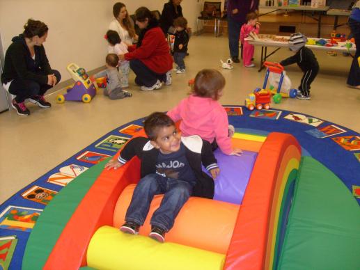 Children climb and play at the Parent Child Workshop