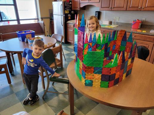 Two children worked together to create a magna tile castle.