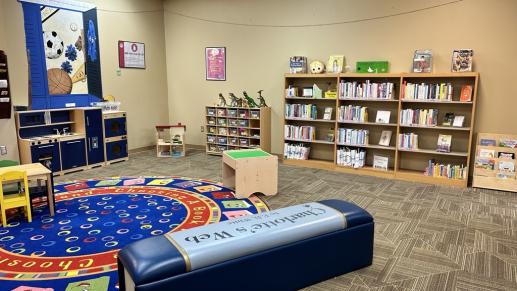 Public floor space including toys, parenting collection, and board book offerings