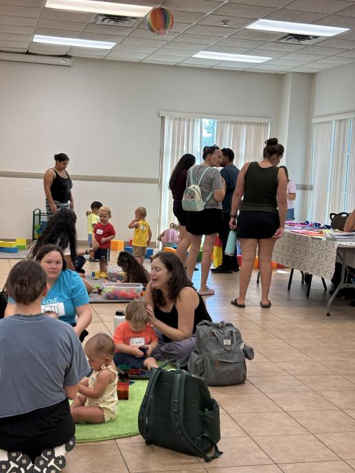 Mommas Chatting, Babies Playing at Block Party.