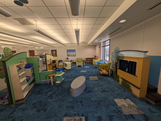 Koelbel Library has a beautiful play space filled with early learning opportunities like toys, pretend kitchen and market, and puppet theatre.