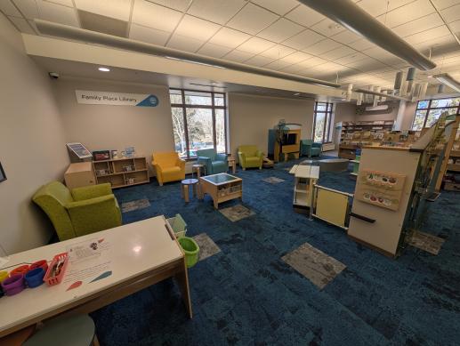 Koelbel Library children's space with play cafe, age-appropriate toys, and writing table.