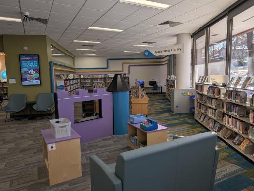 Castlewood Library children's space with play castle fixture and toys.