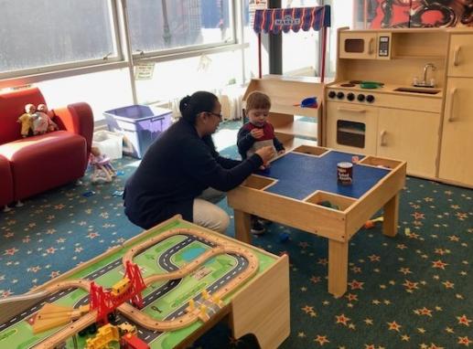 Child plays with mother in the Play Area