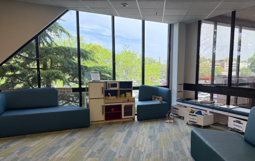 Station Branch Play Area including seating, toys, and kitchen area