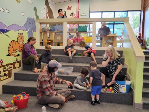Families enjoy playtime together at Kutztown Community Library in loft area.