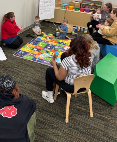 Families with children gathered for youth program