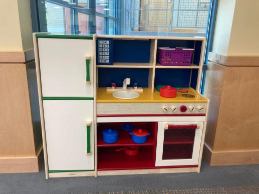 The play kitchen in our play area. 