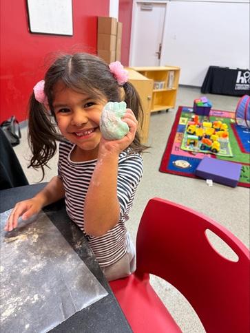 One of our family place attendees having fun at the Art Exploration station!