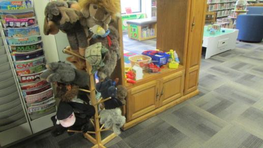Dramatic play area with puppets and grocery store.