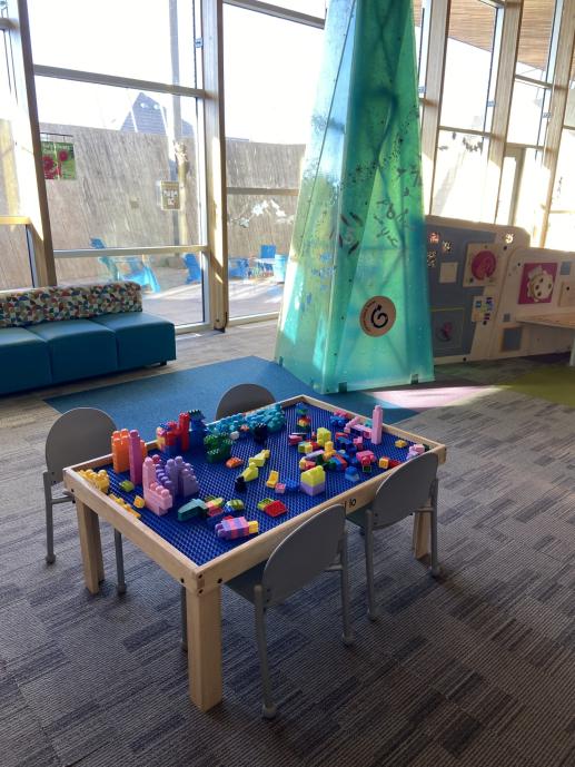 Picture of the lego table and Early Literacy Center at the Northwest Library.