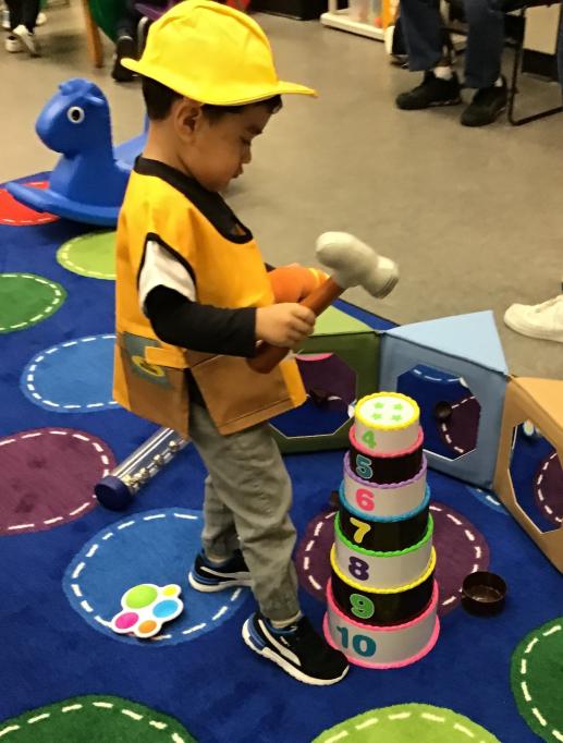 Toddler in Construction Play Clothes at Family Place Library