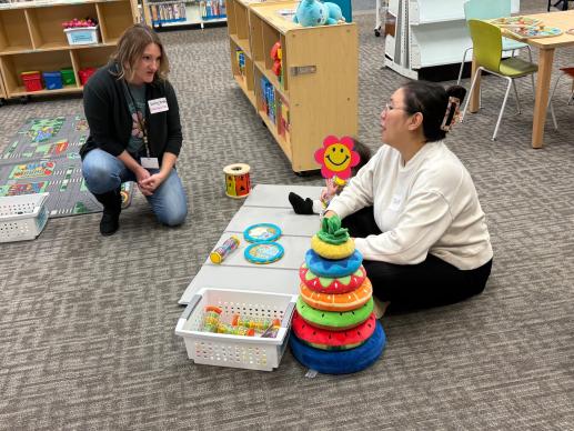 Parent speaking with local ECE during Annual Workshop